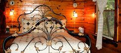 Queen Sized Bed in Cedar Splendor Cabin at a Lazee Daze in the Ozarks in Eureka Springs Arkansas